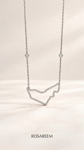 RosaReem Love UAE Necklace on neutral background