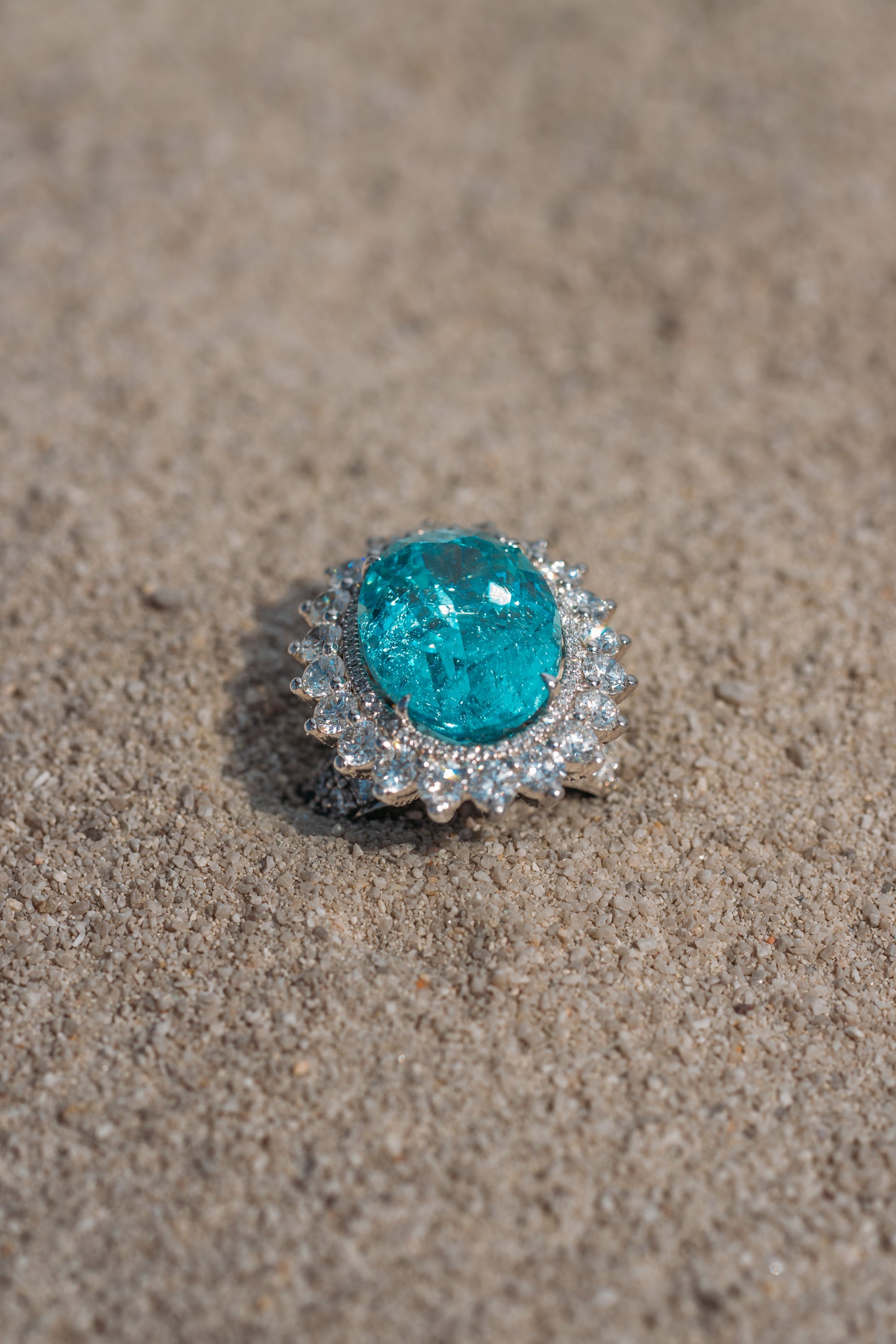 Verbesa Atelier 20ct lab-grown Paraiba sapphire cocktail ring styled on sand