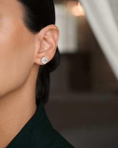 Model wearing Verbesa Atelier cushion-cut lab-grown diamond stud earrings
