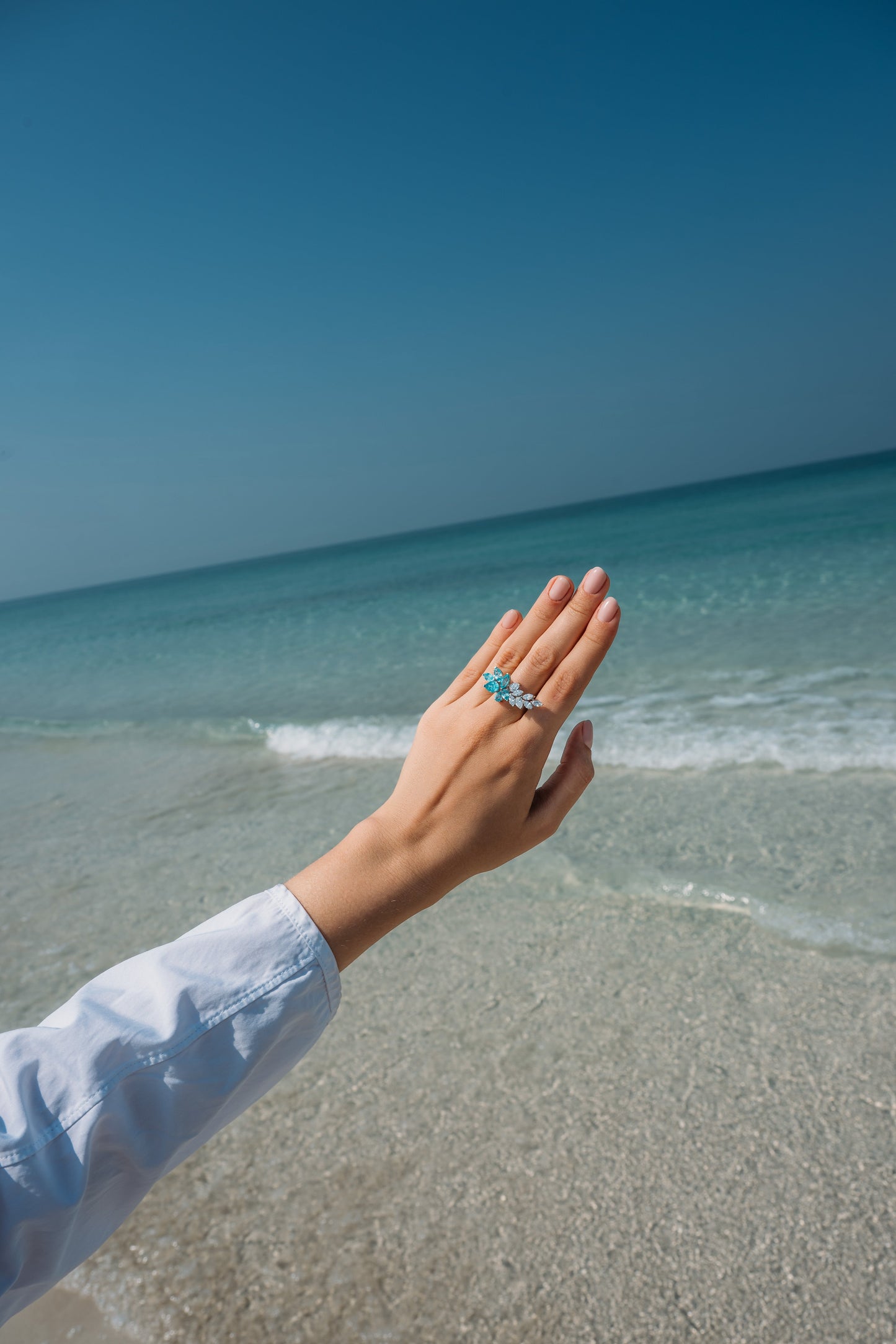 Verbesa Atelier lab-grown Paraiba sapphire branch cocktail ring worn by the sea