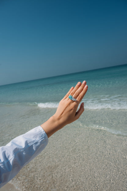Verbesa Atelier lab-grown Paraiba sapphire branch cocktail ring worn by the sea