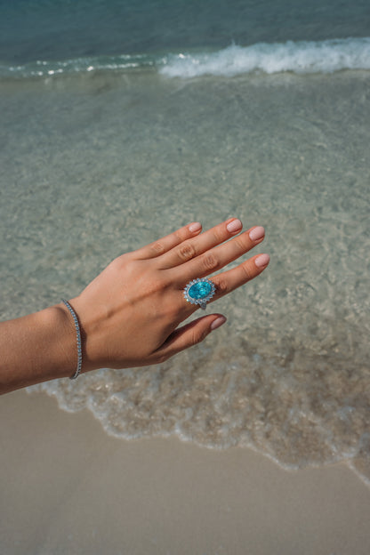 Model wearing Verbesa Atelier oval-cut lab-grown Paraiba sapphire cocktail ring