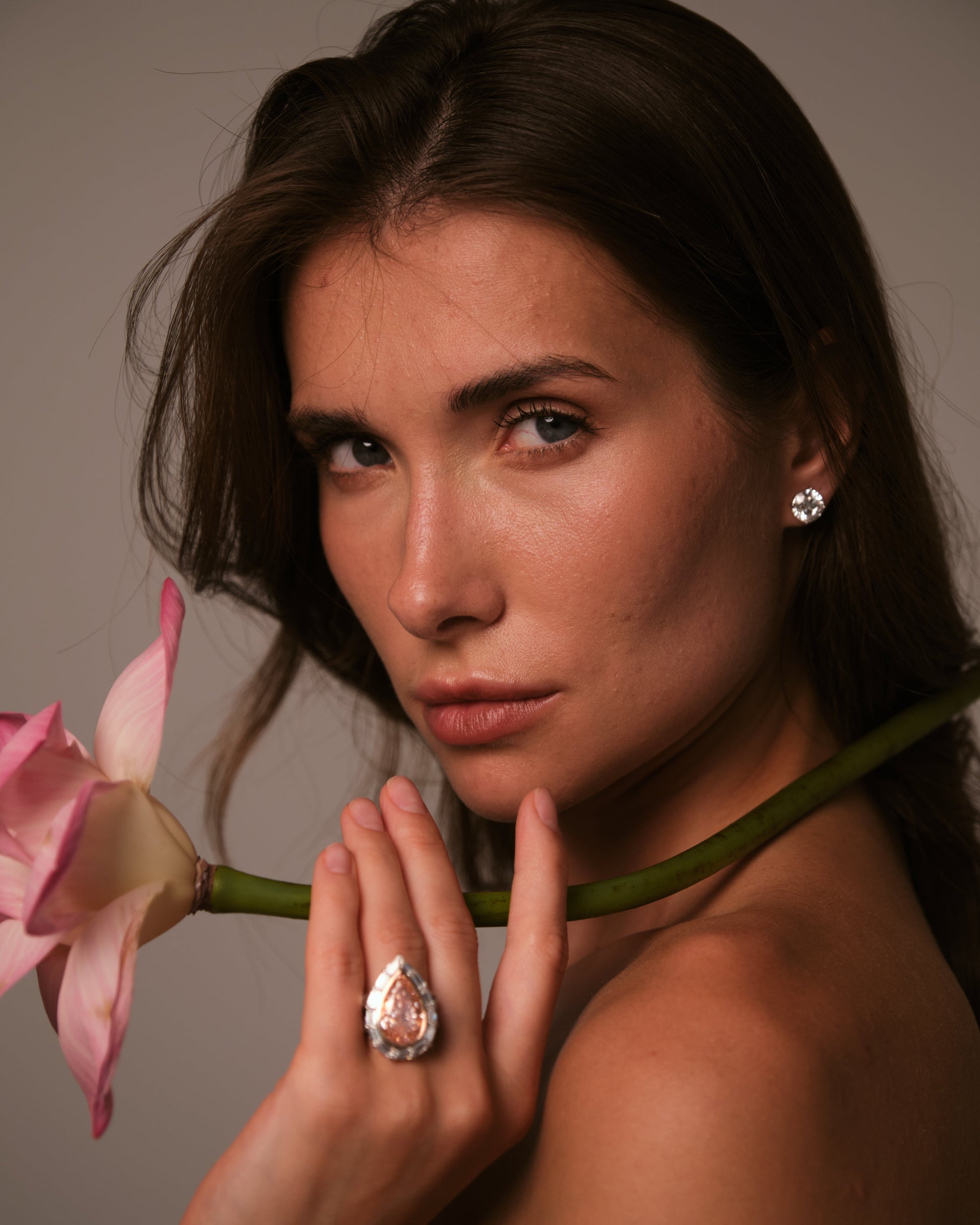 Model wearing Verbesa Atelier round-cut lab-grown diamond stud earrings
