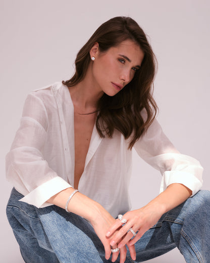 Model wearing Verbesa Atelier round-cut lab-grown diamond stud earrings