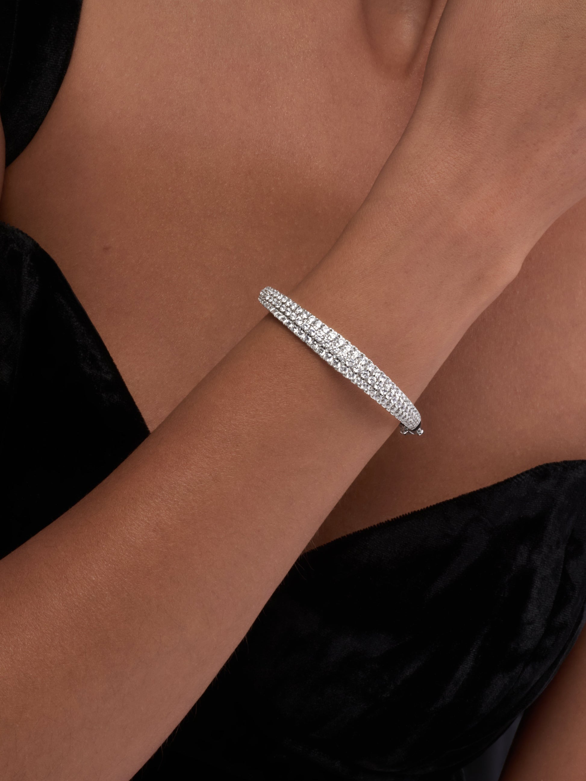 White Drop dune three row bangle worn in an original lifestyle image