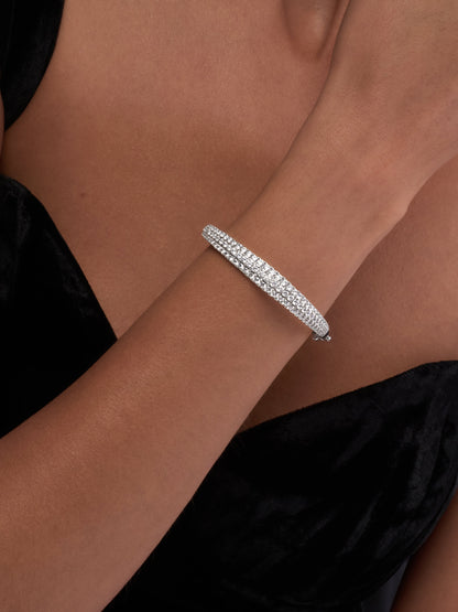 White Drop dune three row bangle worn in an original lifestyle image