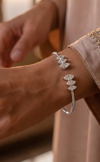 White Drop Marquise Open Cuff in white gold worn in an original lifestyle image