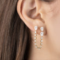 White Drop pear chain earring worn in an original lifestyle image