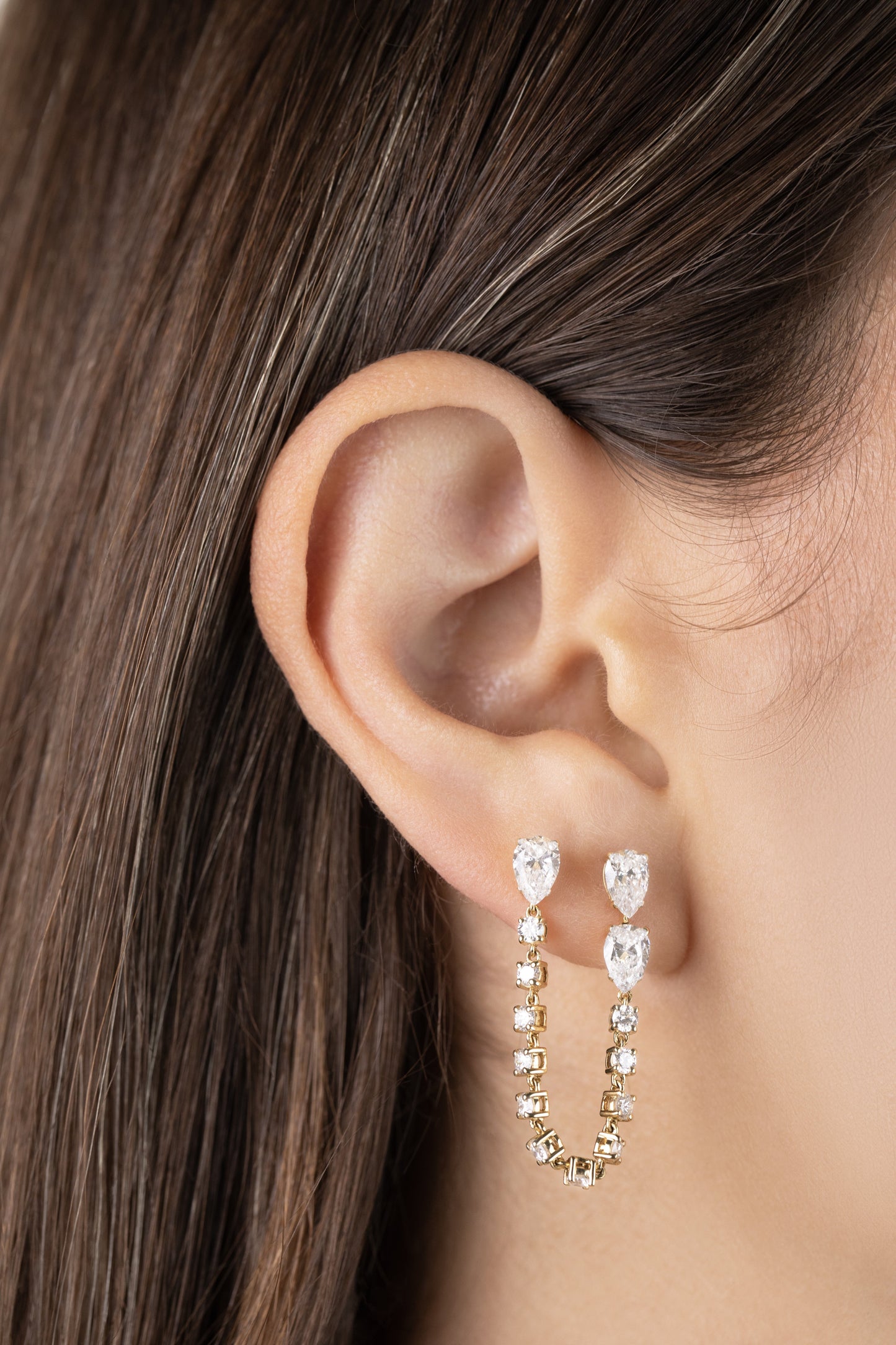 White Drop pear chain earring worn in an original lifestyle image