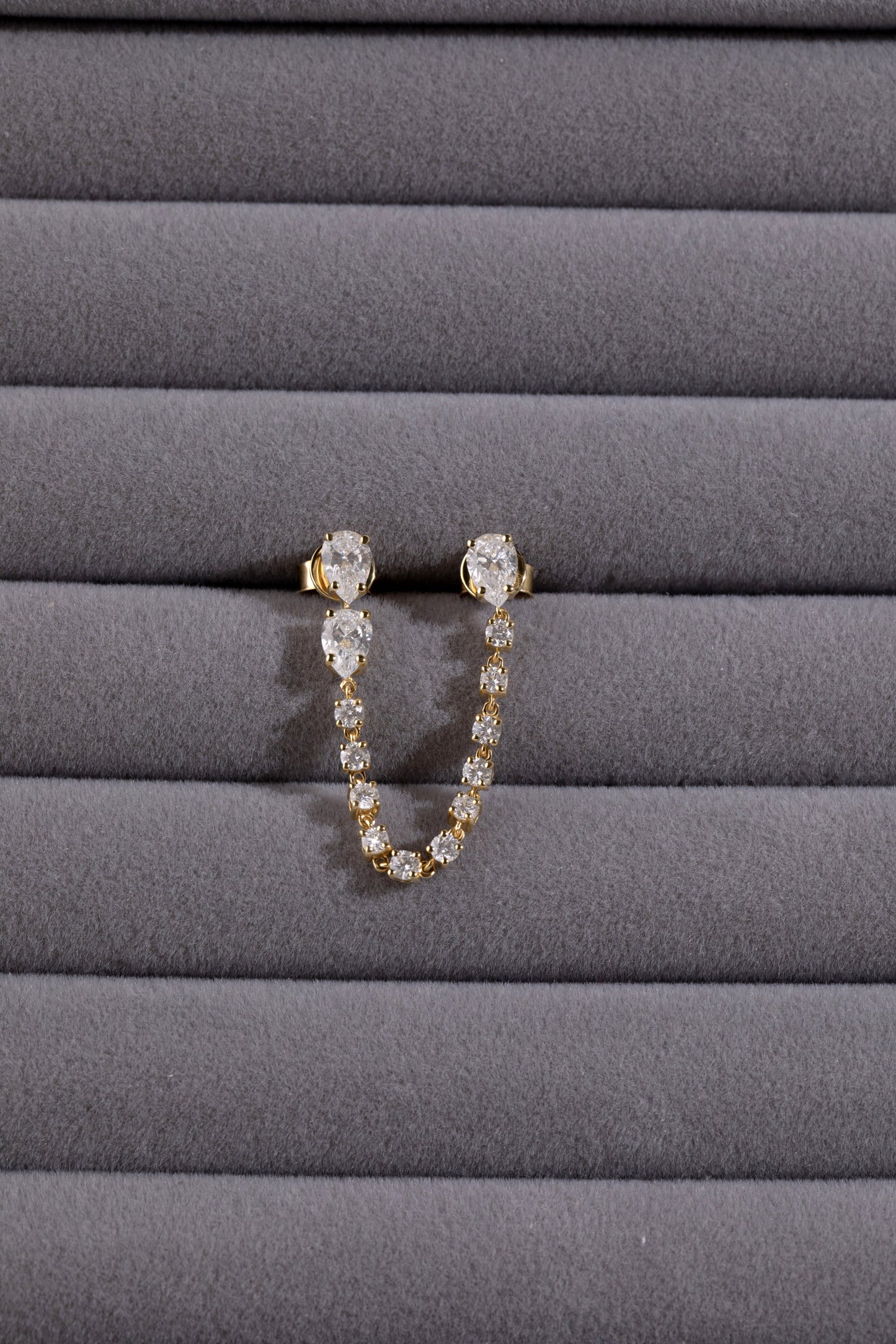 White Drop pear chain earring worn in an original lifestyle image