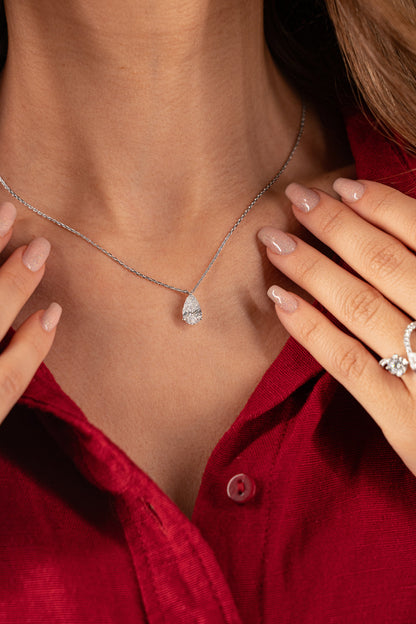 White Drop pear diamond pendant necklace worn in an original lifestyle image