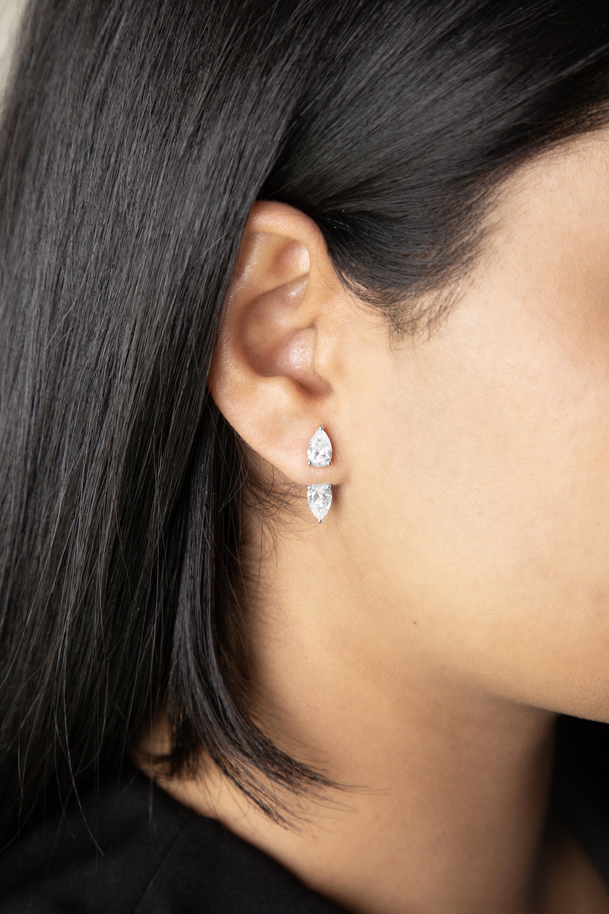 White Drop pear diamond studs ear jackets worn in an original lifestyle image