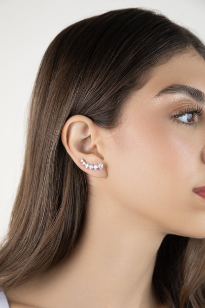 White Drop round six diamond ear climber worn in an original lifestyle image