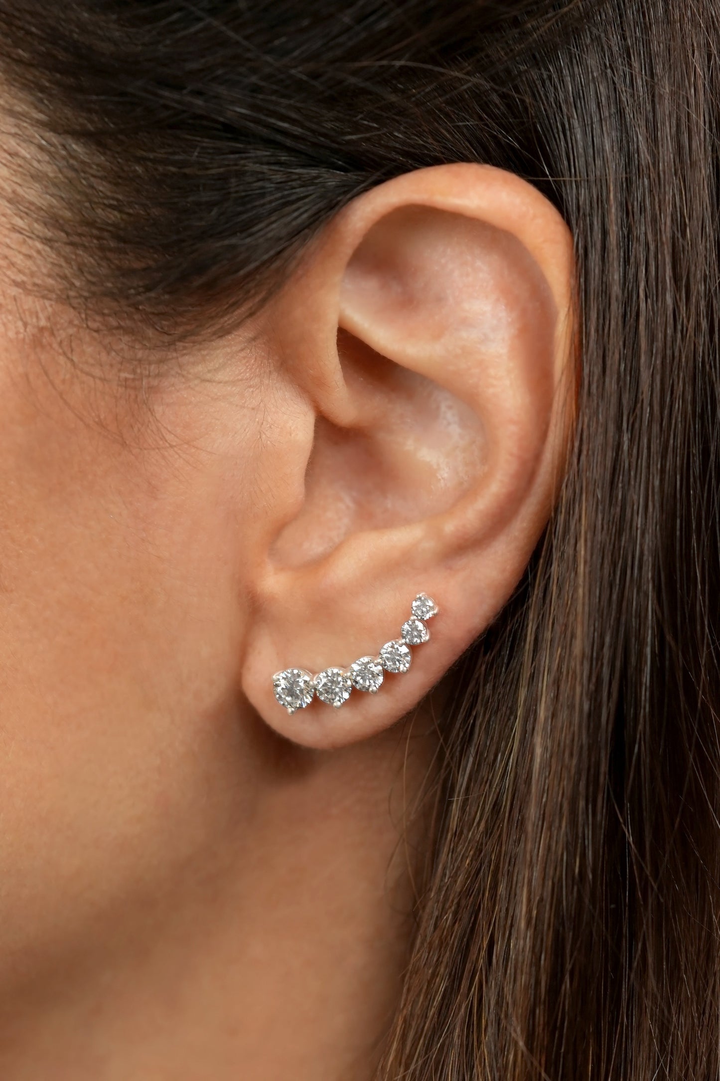 White Drop round six diamond ear climber worn in an original lifestyle image
