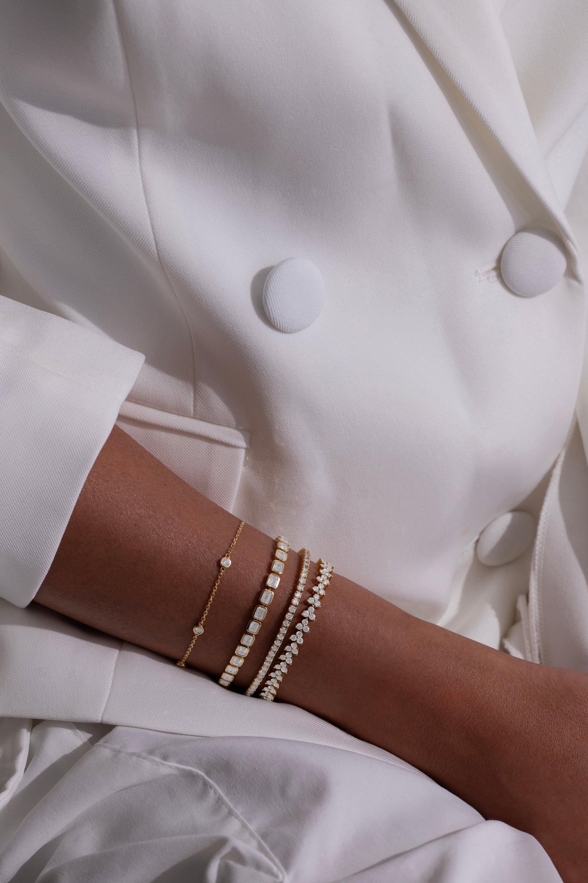 White Drop stardust tennis bracelet worn in an original lifestyle image