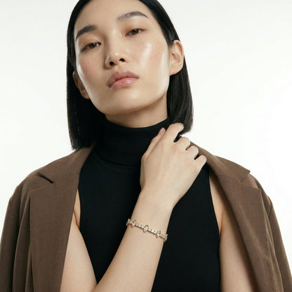 ZORÁE Core Apex 18K yellow gold bracelet worn on model