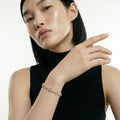 ZORÁE Core Apex 18K yellow gold bracelet worn on model