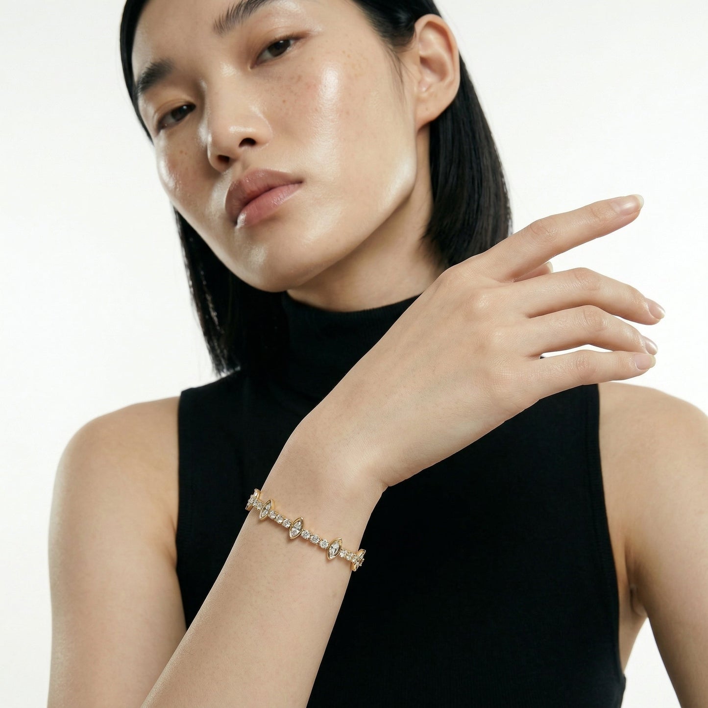 ZORÁE Core Apex 18K yellow gold bracelet worn on model