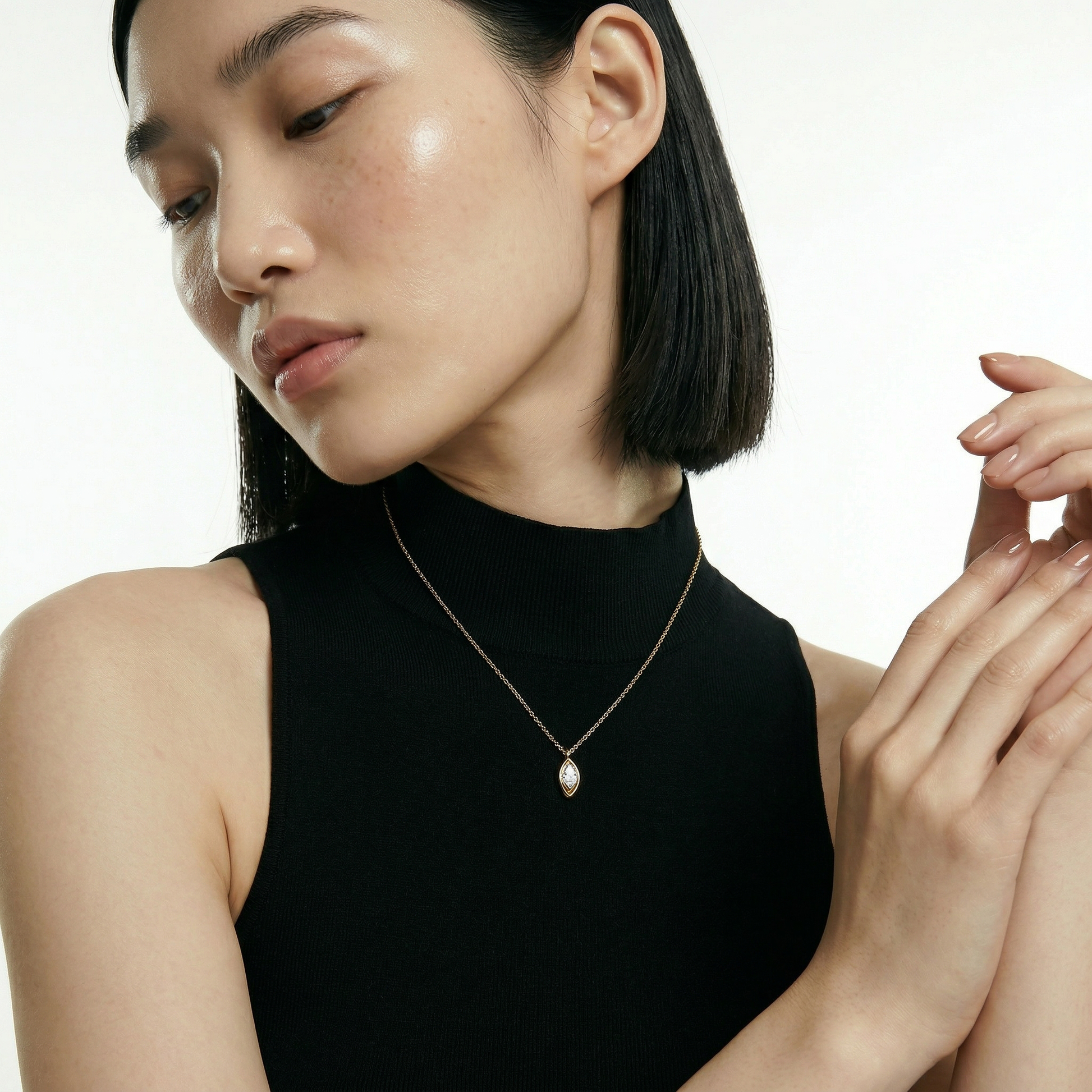 ZORÁE Core Axis 18K yellow gold necklace worn on model
