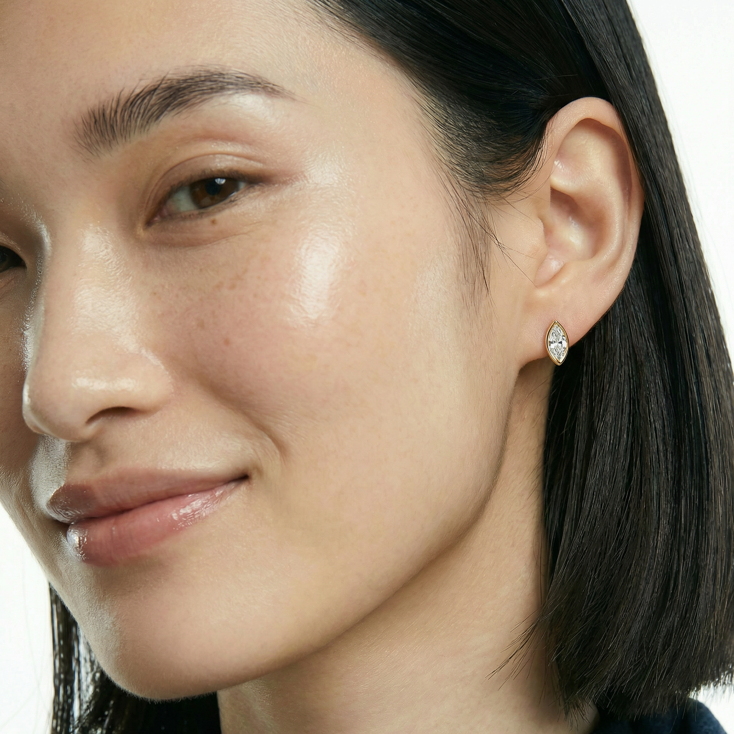 ZORÁE Core Axis Studs 18K yellow gold earrings worn on model