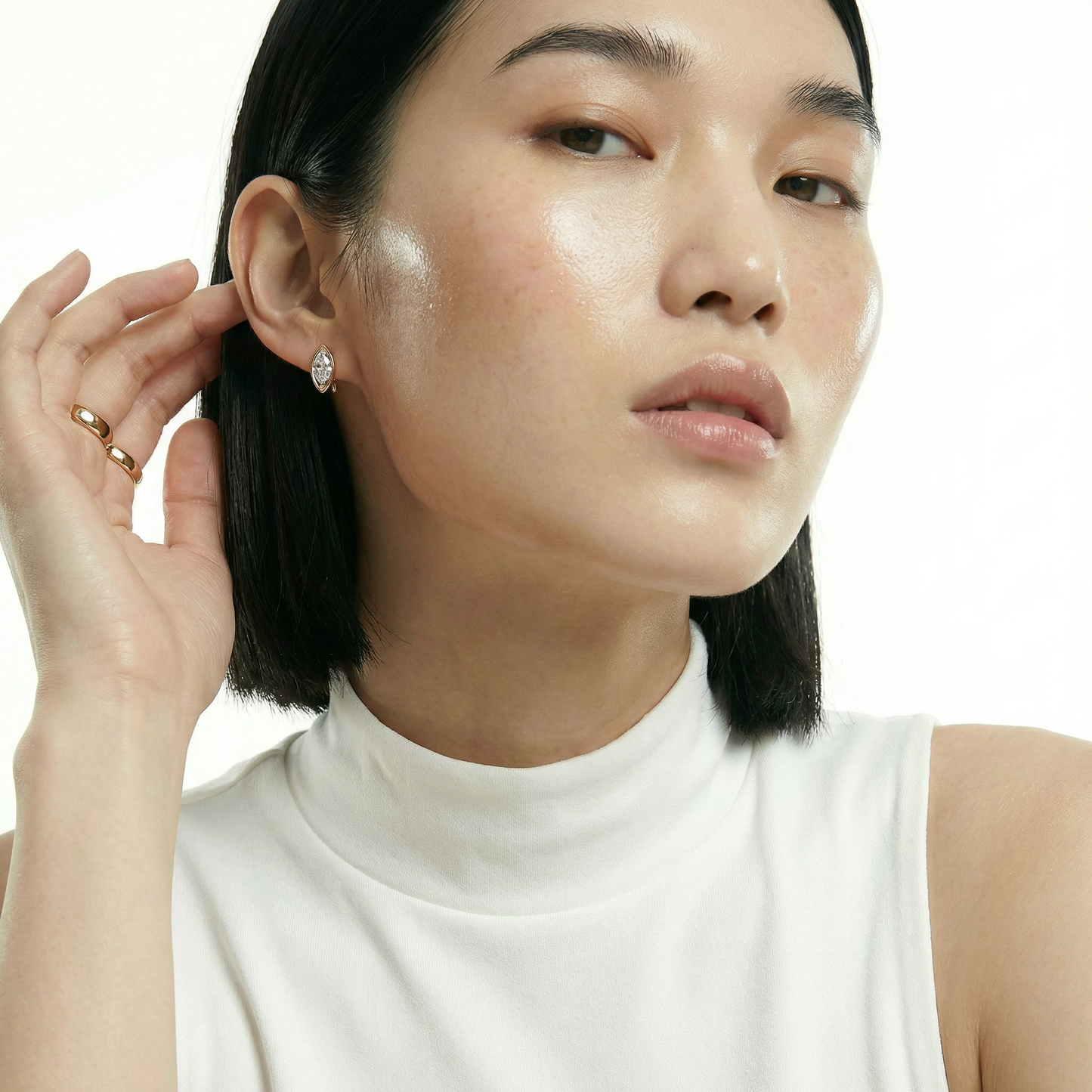 ZORÁE Core Axis Studs 18K yellow gold earrings worn on model