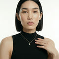 ZORÁE Core Frame 18K yellow gold necklace worn on model
