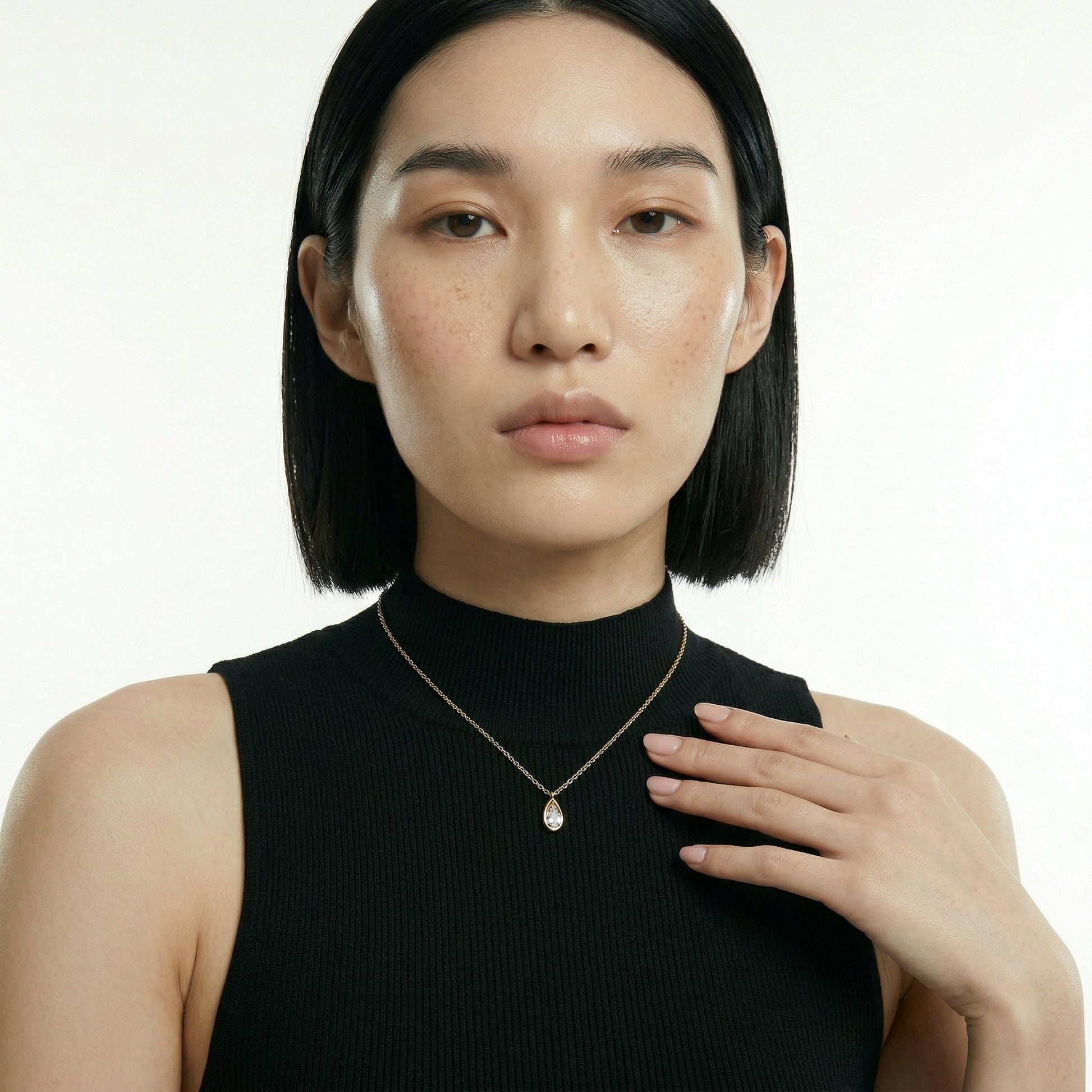 ZORÁE Core Frame 18K yellow gold necklace worn on model