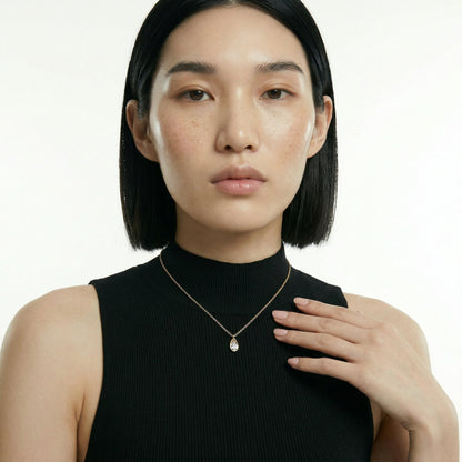 ZORÁE Core Frame 18K yellow gold necklace worn on model