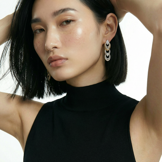 ZORÁE Unbound Eclipse 18K yellow gold earrings worn on model