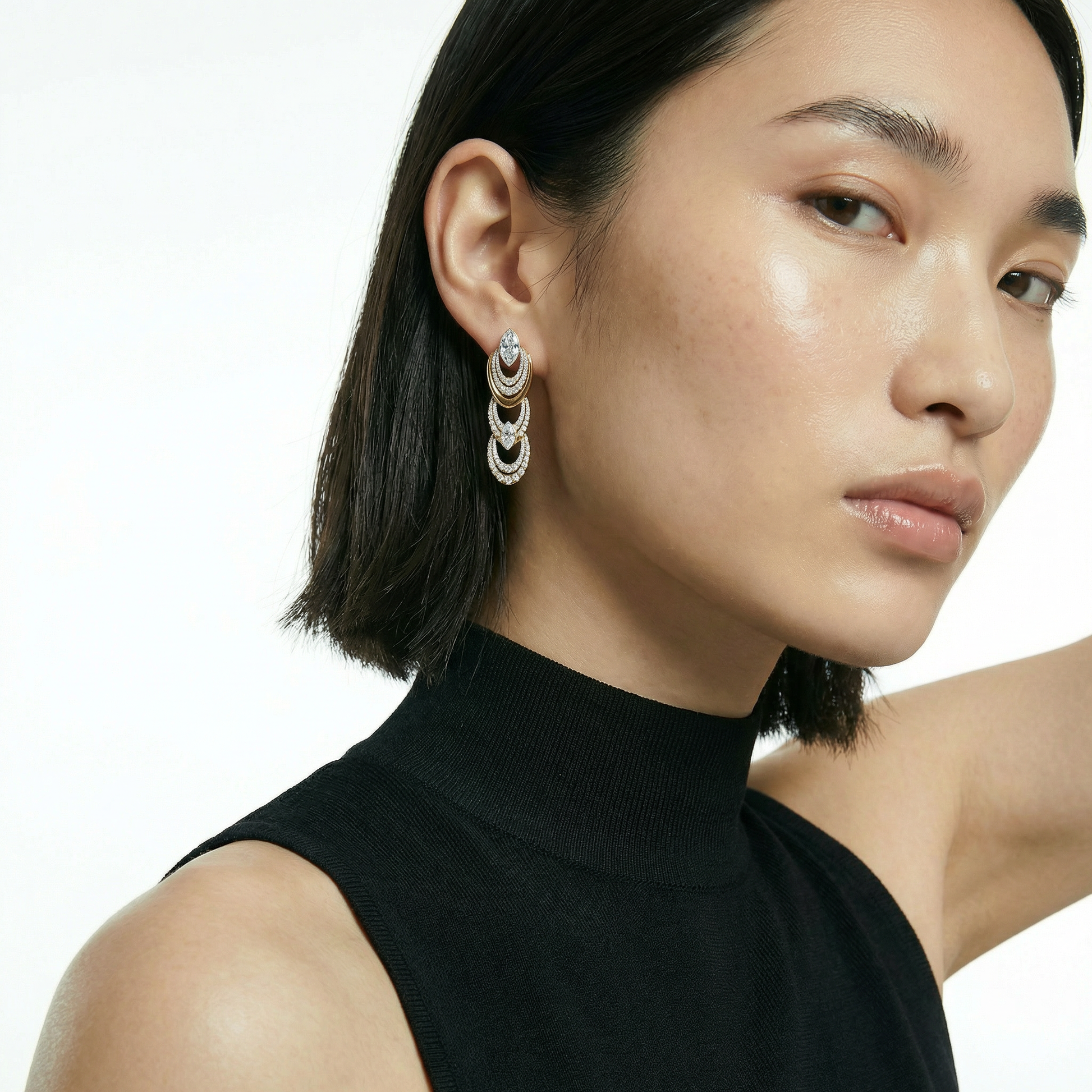 ZORÁE Unbound Eclipse 18K yellow gold earrings worn on model